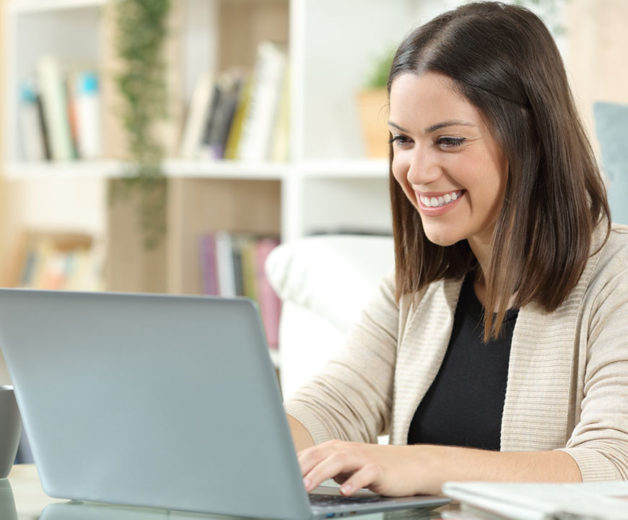 Lady on the computer looking for a title company in Fayetteville