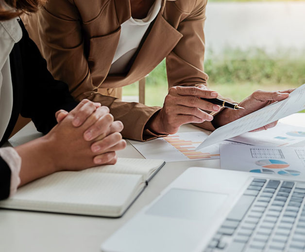 people reviewing documents for a Title and Escrow in Rogers