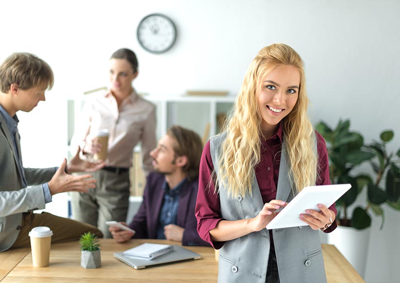 Friendly office staff helping someone with escrow service in Springdale, AR